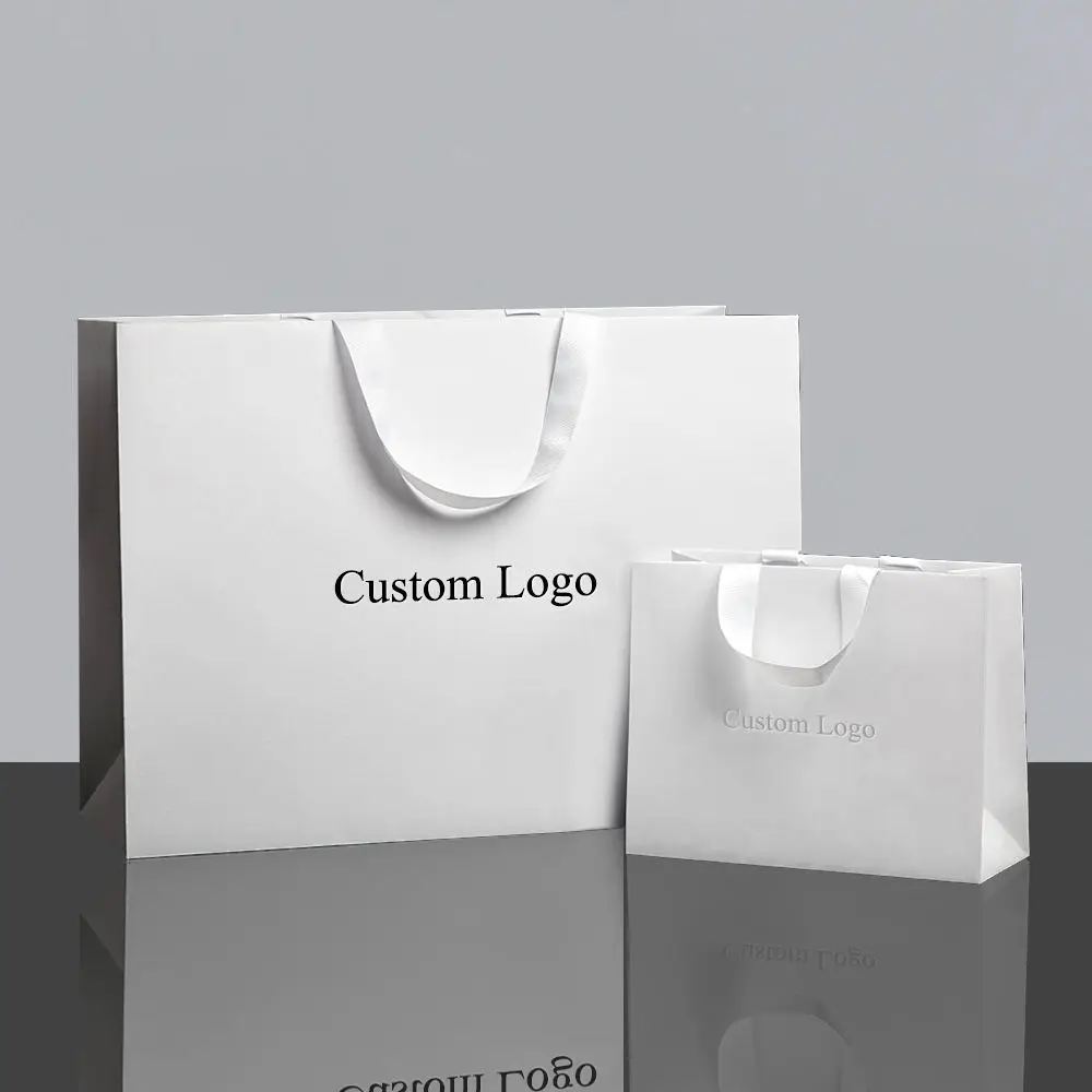 Luxury Mall Shopping Bags - White luxury paper bags with ribbon handles, custom logo, multiple sizes