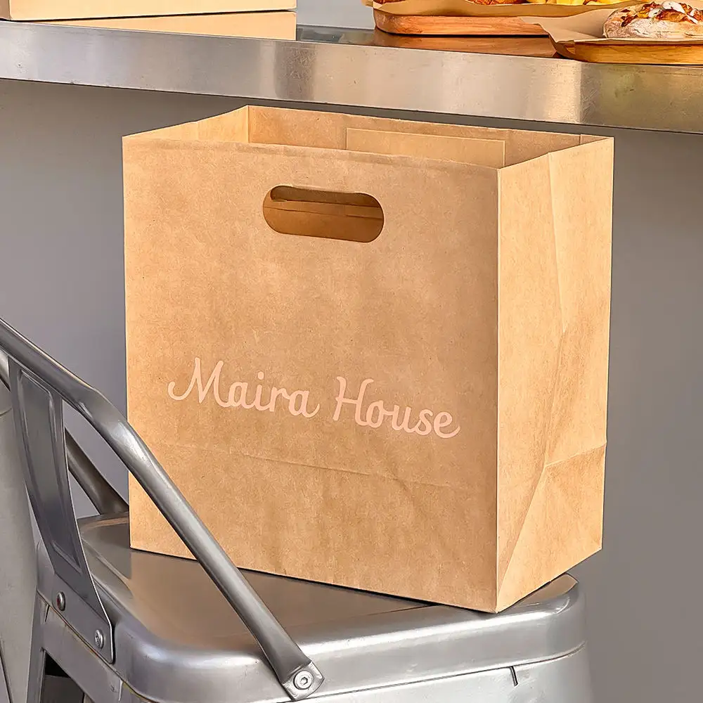 Custom printed brown kraft takeaway bags with die-cut handles for restaurant
