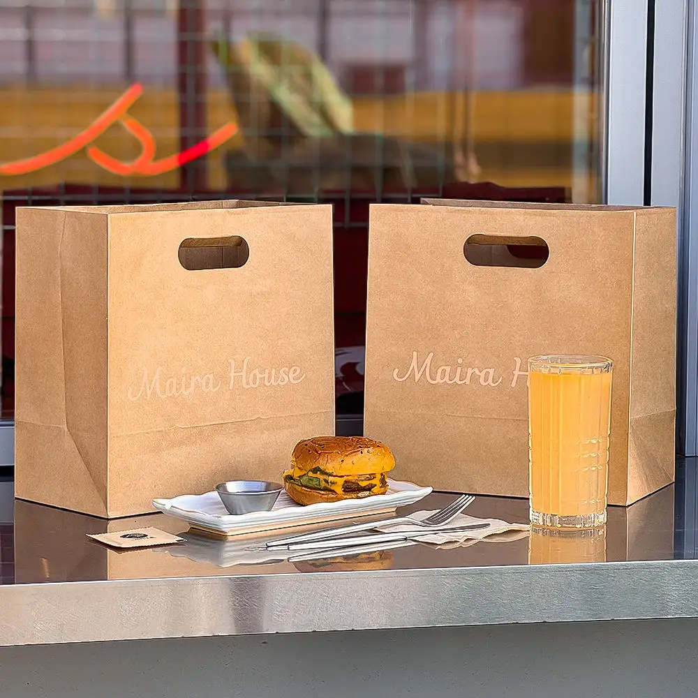 Restaurant Fast Food Delivery Bags - Two brown kraft paper bags with burger and juice, die-cut handles